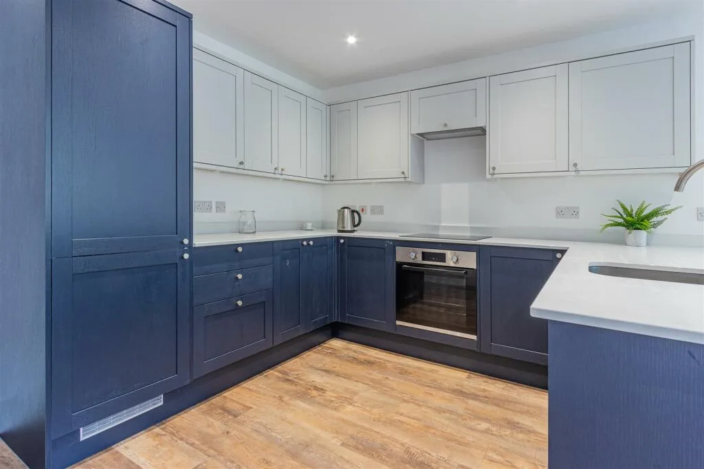 Navy and light grey shaker kitchen fitted by Tyro Carpentry in Port Talbot