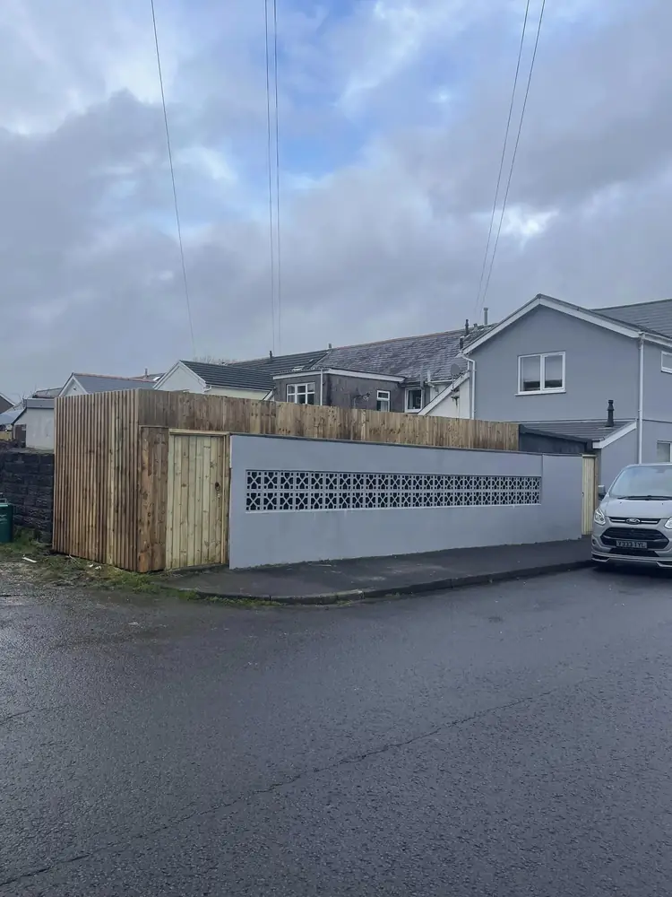 Close-boarded fencing and a matching timber gate fitted on a corner plot in Port Talbot